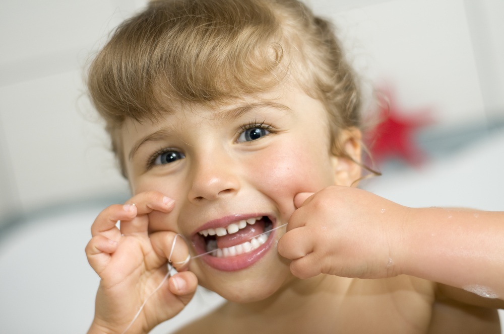 girl flossing
