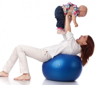 Happy family with  fitness ball.