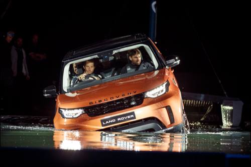 land-rover-bar-team-principal-sir-ben-ainslie-drives-the-new-land-rover-discovery-at-global-unveiling-at-packington-hall-solihull-uk-accompanied-by-team-manager-jono-macbeth