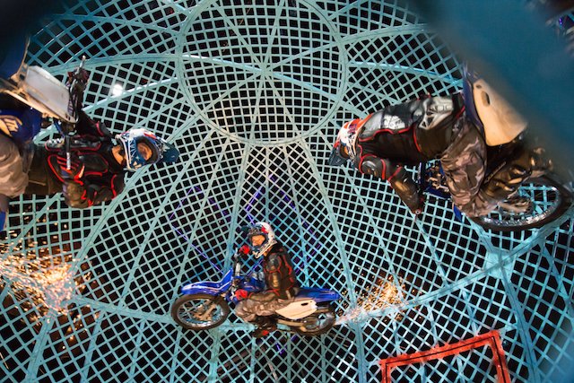 Cirque Berserk motorbikes in a cage 