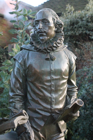 bronze statue of william shakespeare in the garden inside his birthplace at stratford upon avon