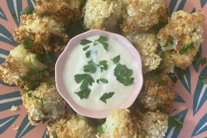 cauliflower bites on a pink plate