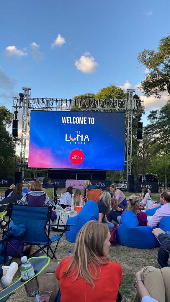 people watching luna cinema screening of elvis movie at kew gardens posing for mums magazine