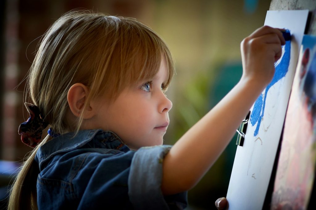 child practising handwriting
