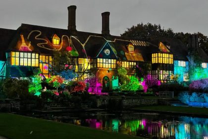 Houses lit with colourful lights at the Christmas glow walk at RHS Garden Wisley