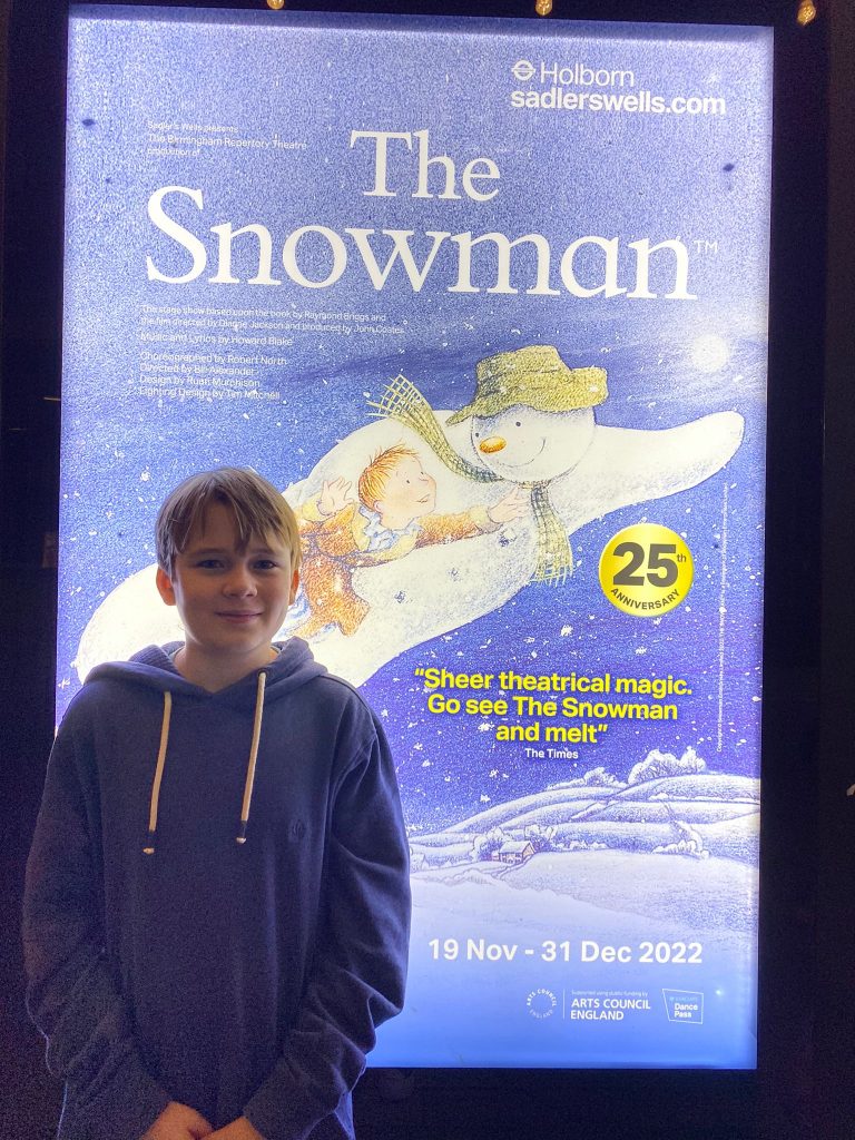 teeanger posing for mums magazine in front of the snowman poster at peacock theatre 