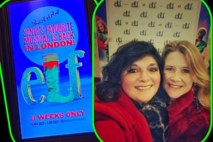 Monica Costa wearing a red coat on the Elf the musical red carpet in london