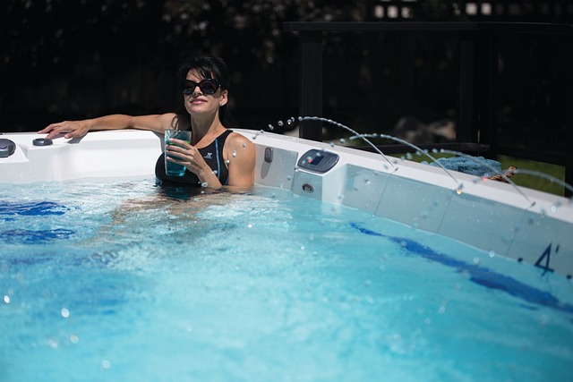 Woman enjoying a drink in a hot tub posing for mums magazine