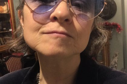 Madeleine with heart shaped glasses ready to go dancing