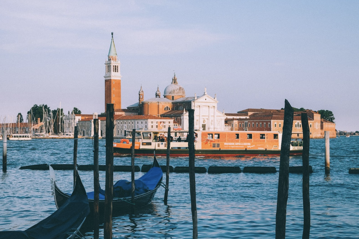 gondola in venice posing for mums' magazine for a feature on Exploring Italy with kids - A family - friendly guide to Italy’s best destinations 