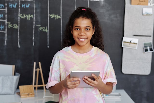girl holding a mobile device 