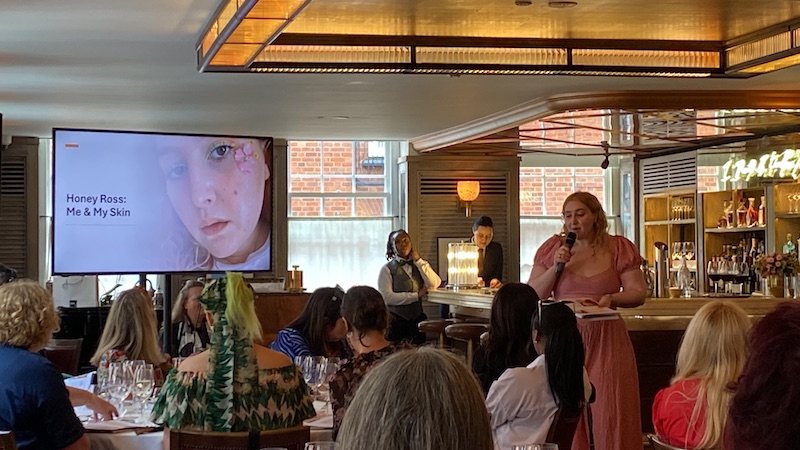 Honey Ross presenting at skincare event
