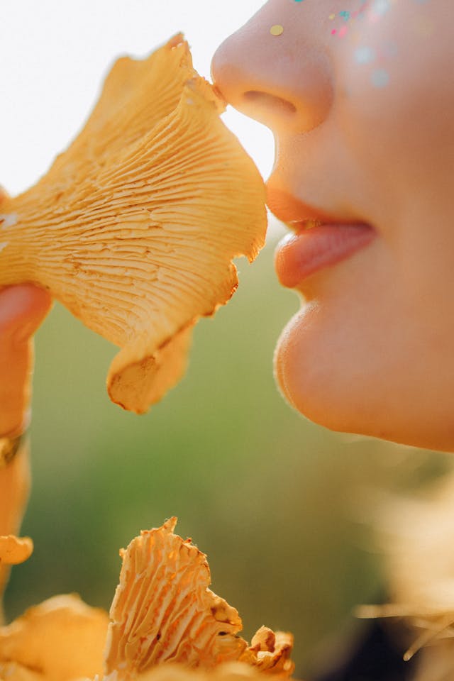 woman holding a mushroom