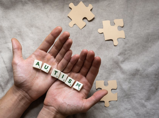 word autism on hands 